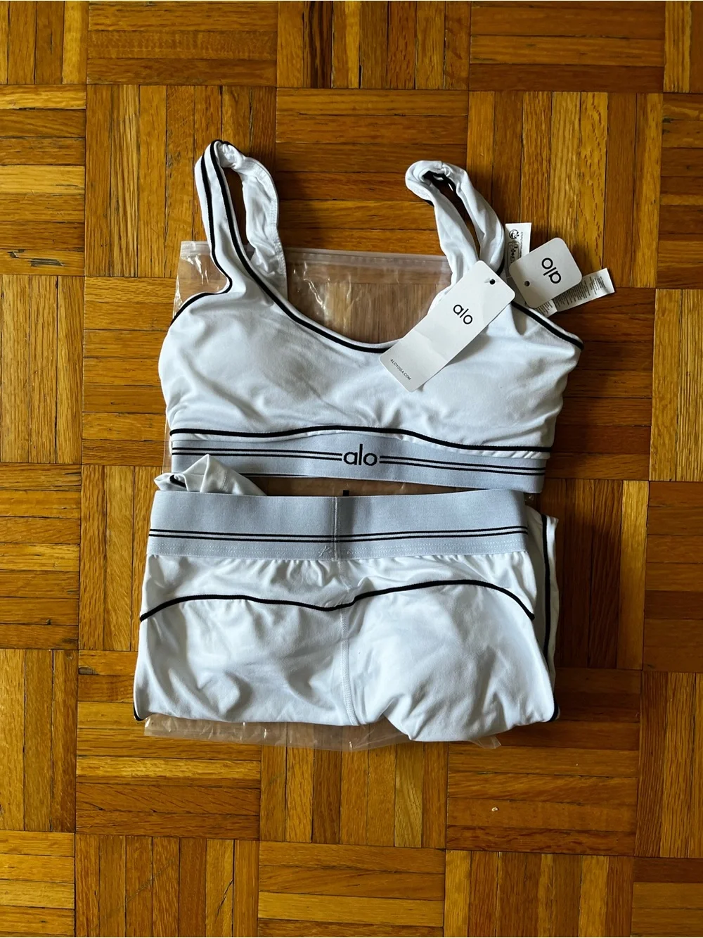 ALO Yoga White Sports Bra and Leggings with Black Piping